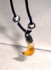 mercury necklace with yellow liquid